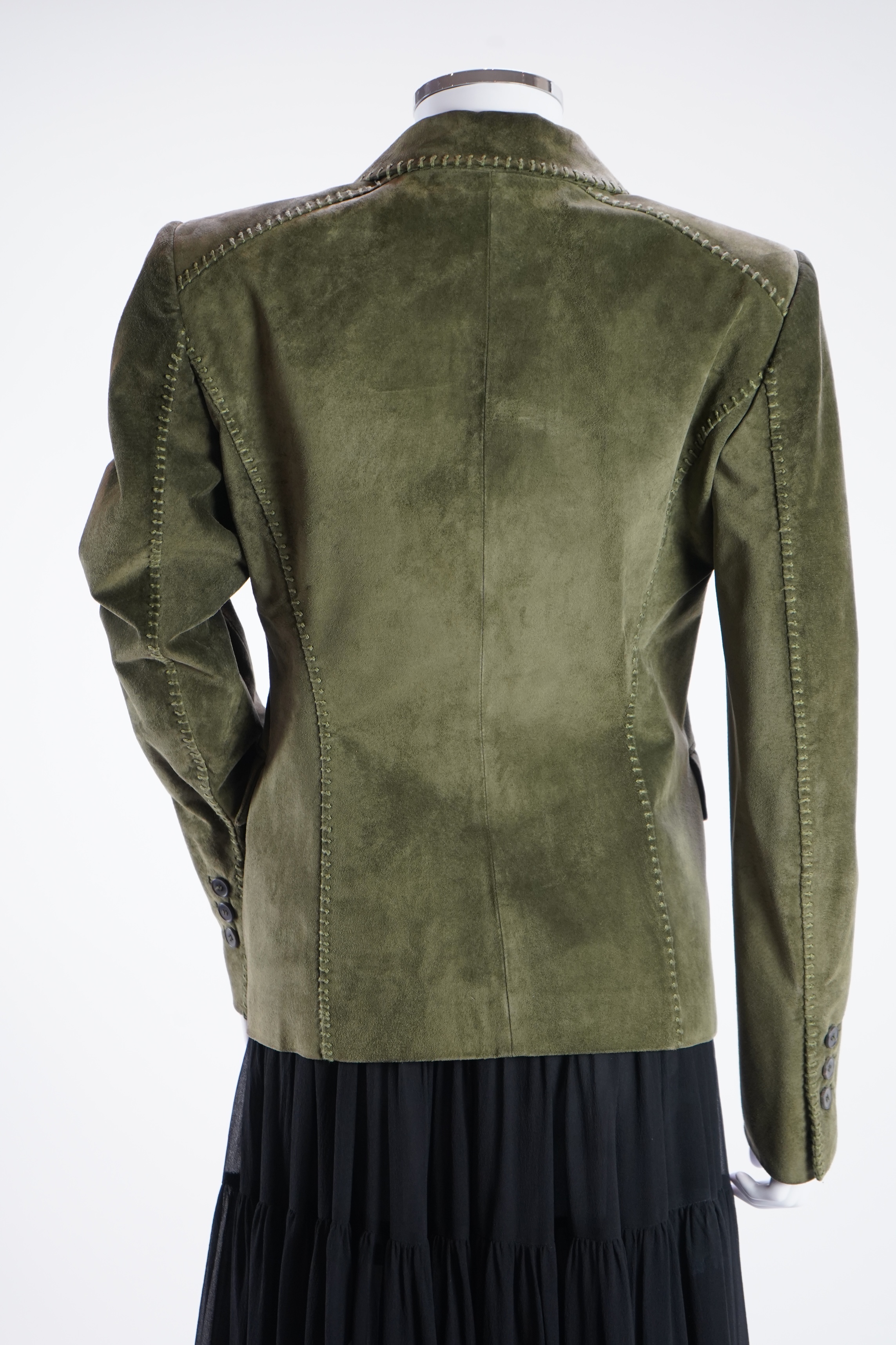 A lady's Yves Saint Laurent olive green suede jacket with stitching details and a black YSL (label missing) gypsy skirt with underskirt. IT 38 (UK size 10)